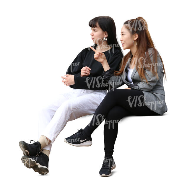 two cut out women sitting and talking