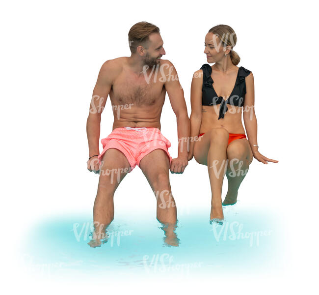 cut out couple sitting on the edge of the pool