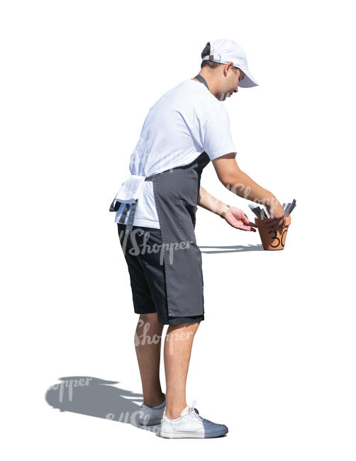cut out waiter laying box of utensils on cafe table