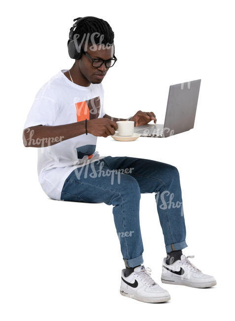cut out man sitting at a cafe with laptop and headphones
