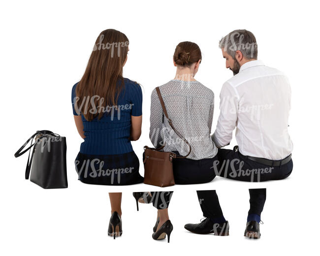 three cut out people sitting seen from back angle