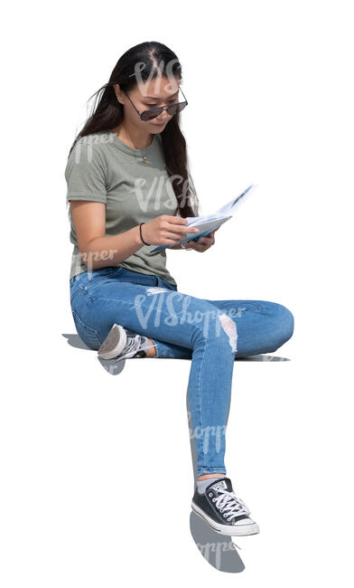 cut out woman sitting outside and reading a book