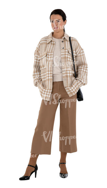 cut out woman in a chic beige outfit standing