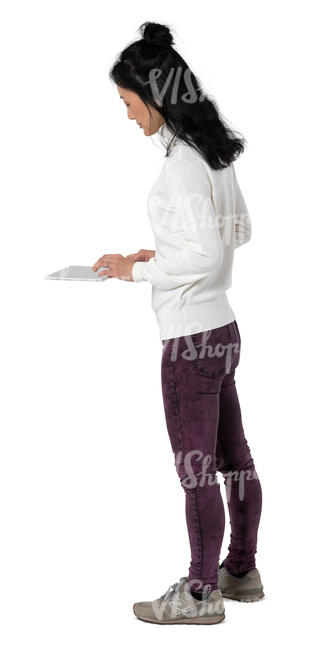 cut out woman standing at a counter and looking at a tablet