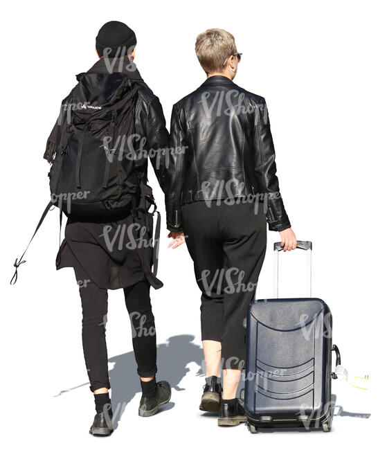 couple in black with travelling bags walking hand in hand