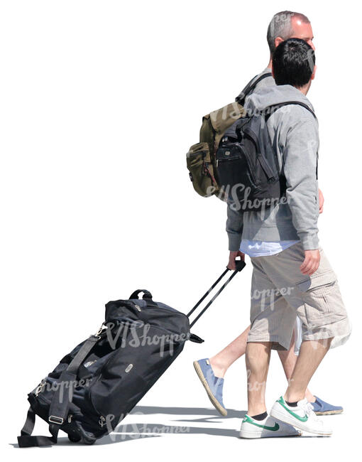 two men with backpacks and suitcases walking down the street