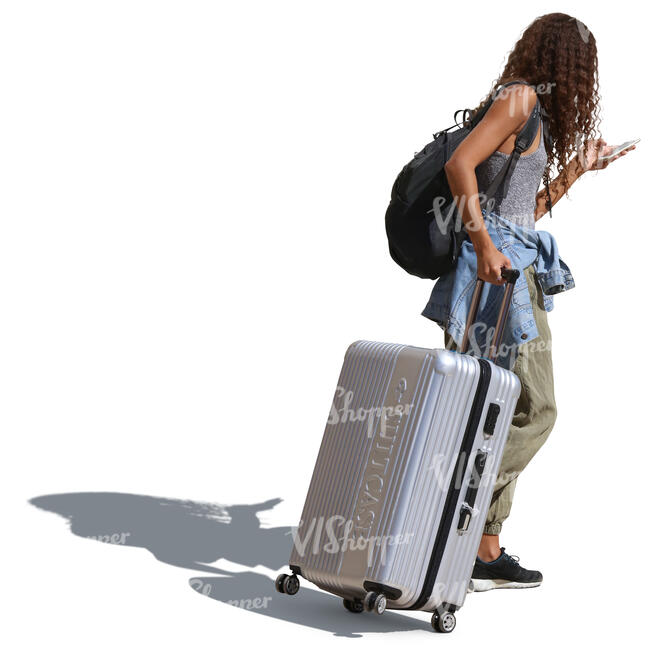 african woman with a suitcase walking down the street