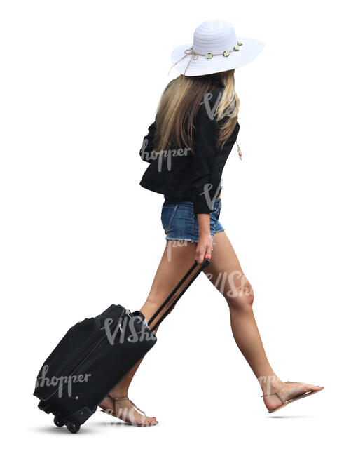 woman with a hat and a suitcase walking