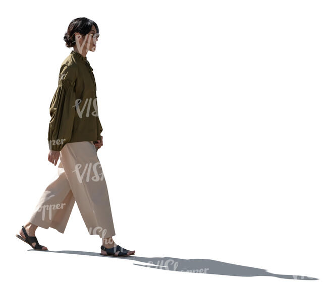 cut out backlit young asian woman walking