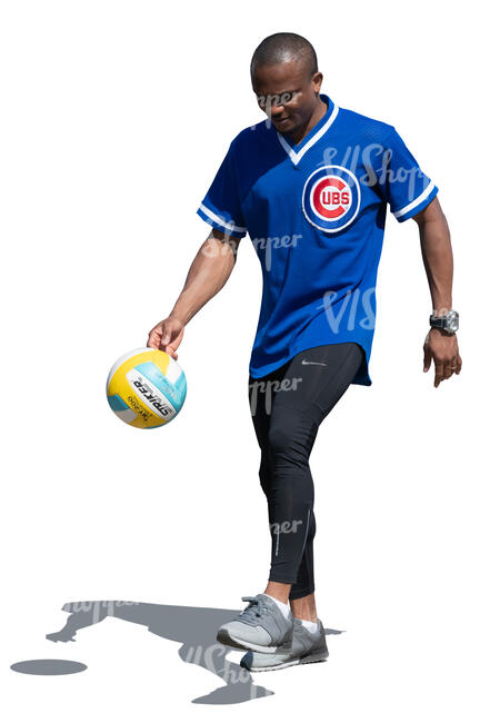 black man juggling a soccer ball