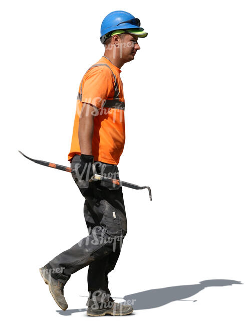 worker with a helmet walking with a crowbar in his hand