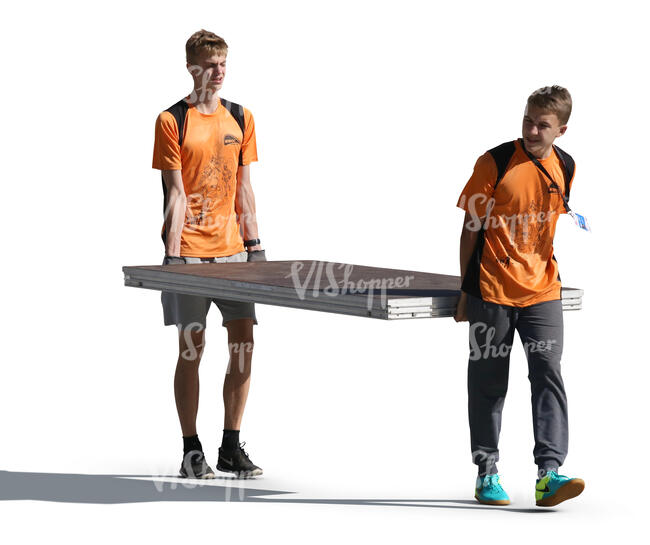 two teenage boys carrying a large table