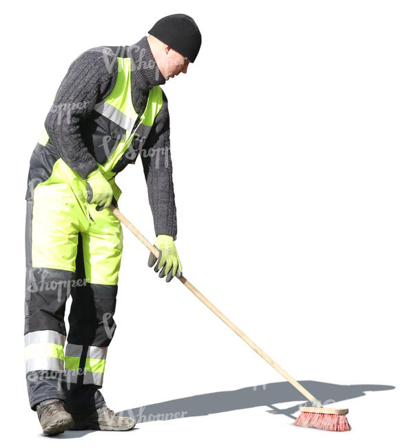 man with street brush doing spring cleaning
