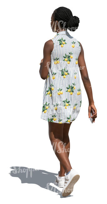 black woman in a light summer dress walking