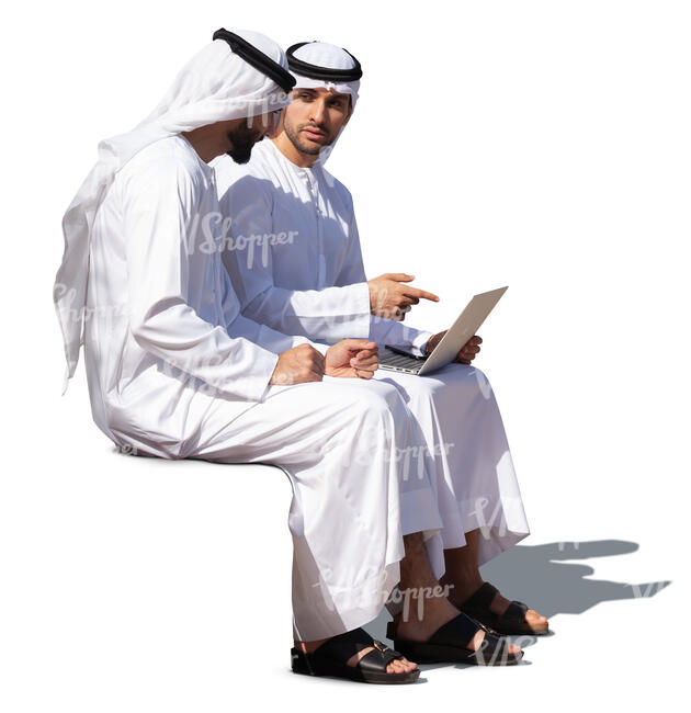 two emirati men sitting and talking