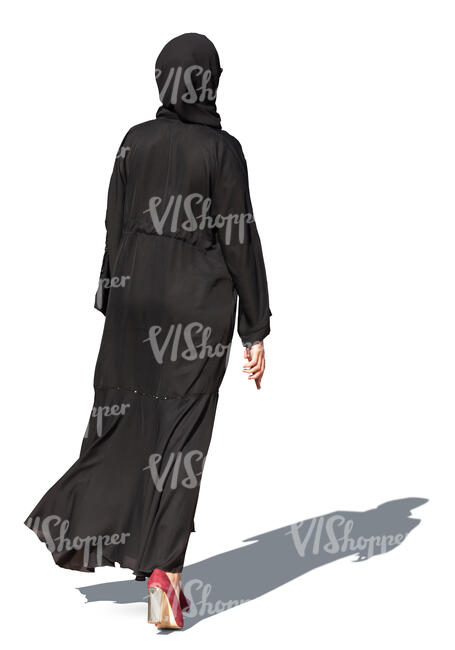 muslim woman in a black abaya walking