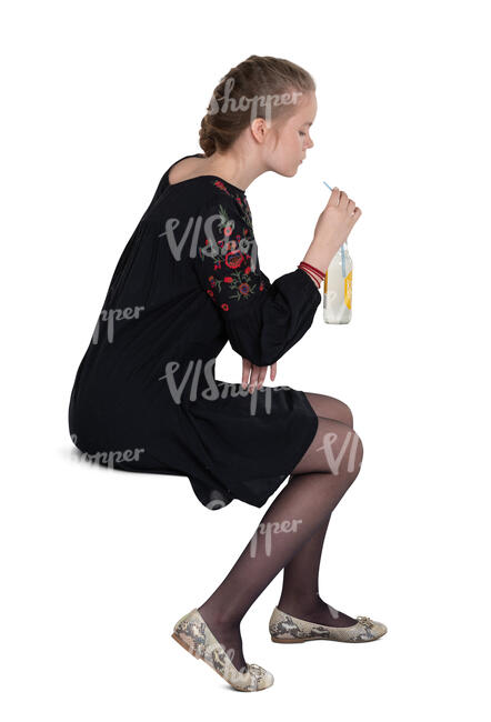 cut out teenage girl sitting in a cafe and drinking lemonade