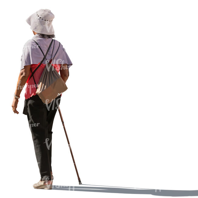 backlit woman with walking stick