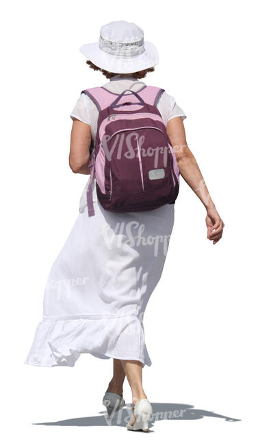 woman in a white dress carrying a backpack walking