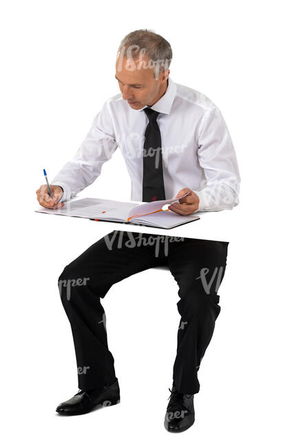 cut out businessman sitting at a table and writing