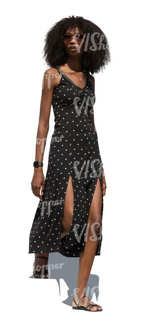 cut out woman in a polka dot dress walking down the stairs