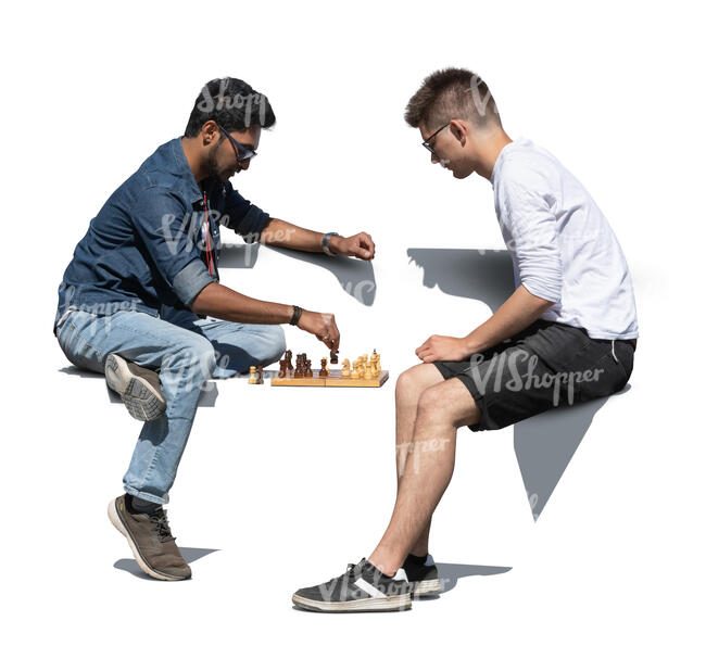 two cut out men playing chess outside on a bench