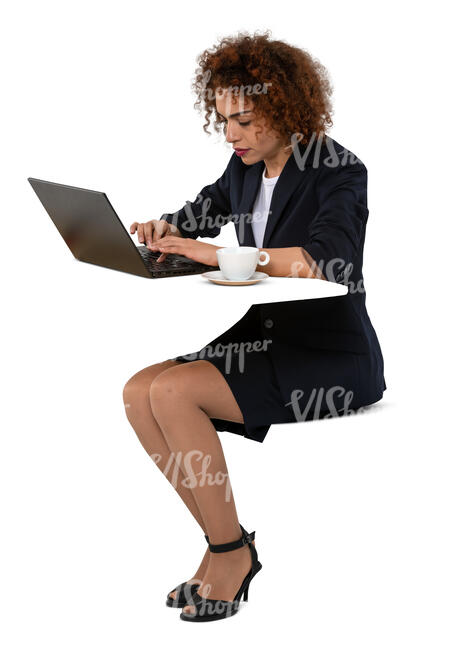 cut out woman with a copmuter sitting at a table and drinking coffee