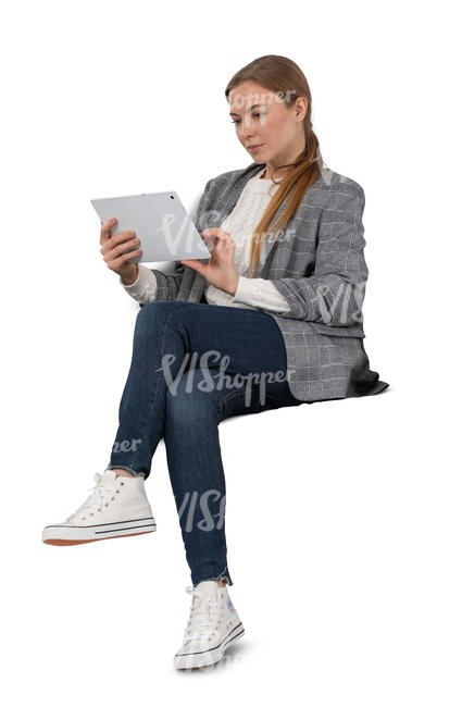 cut out woman sitting and reading from tablet