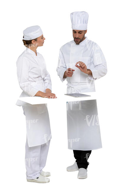 two cut out chefs talking behind a kitchen counter