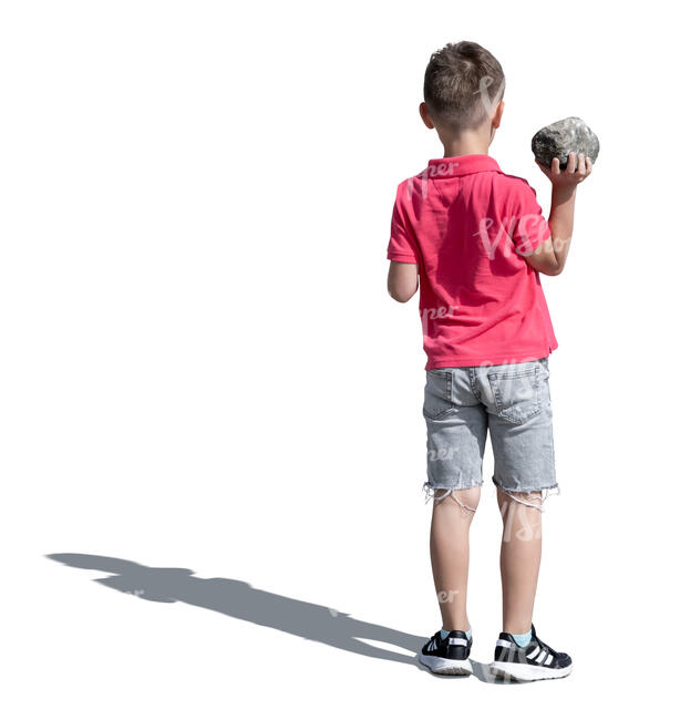 cut out boy standing and holding a rock