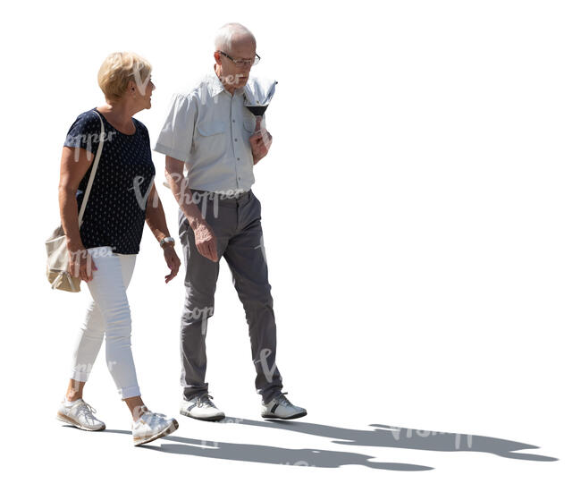 two cut out backlit elderly people walking