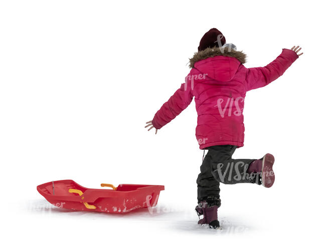cut out girl with a sledge gaving fun in the snow