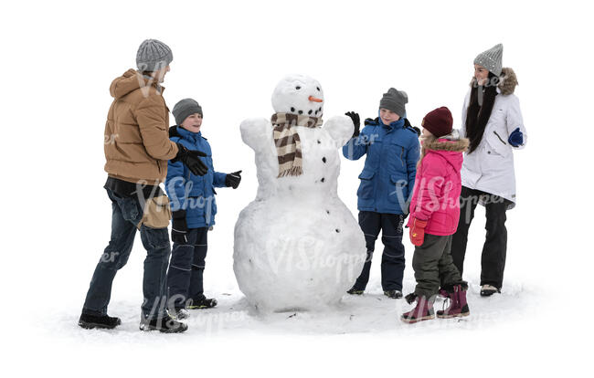 cut out kids and adults building snowman in winter