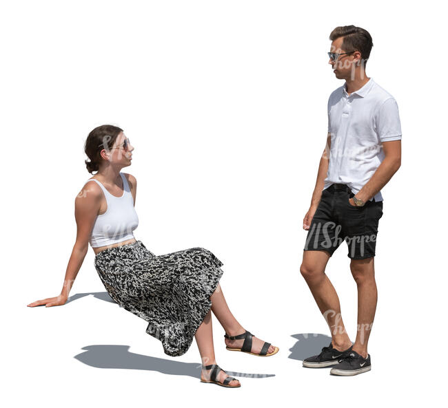 cut out woman sitting and talking to a man standing beside her