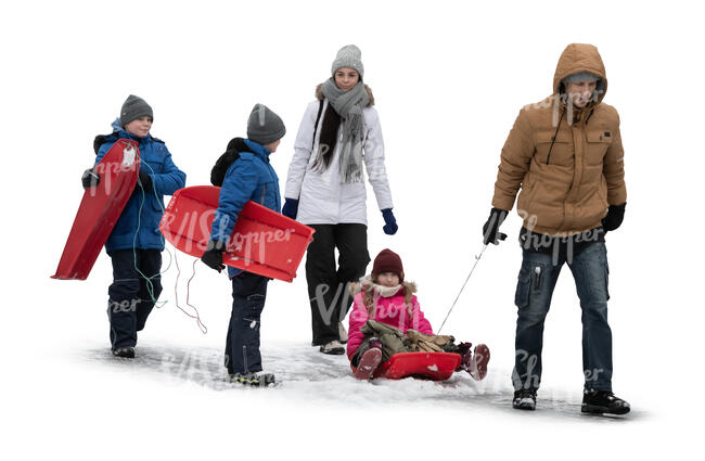 cut out family in winter going sledging