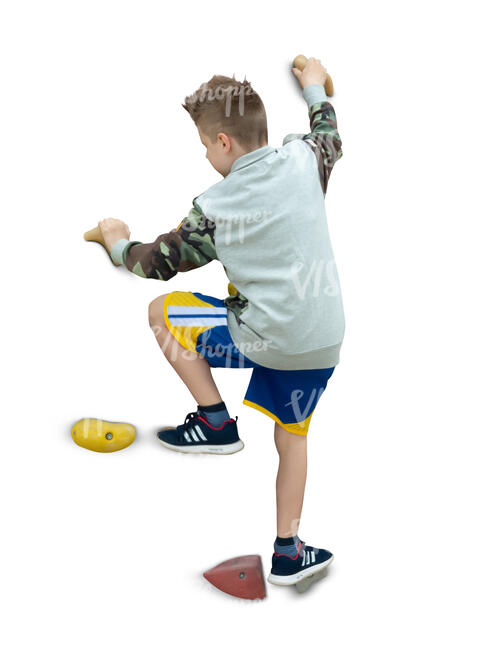 cut out boy climbing on a rock climbing wall