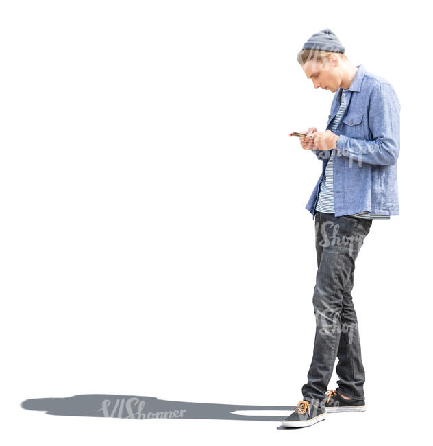 cut out sidelit young man with a phone standing 