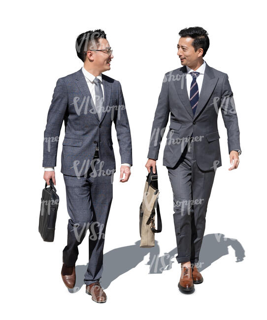 two cut out chinese businessmen walking