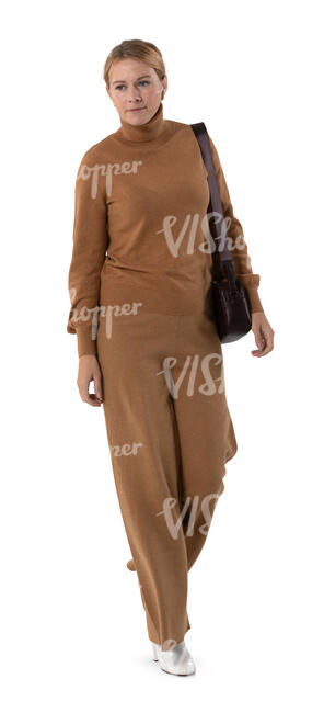 cut out woman in a brown outfit walking