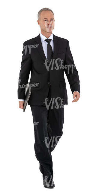 cut out businessman in a black suit walking