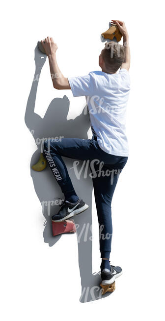 cut out boy climbing on an outdoor climbing wall