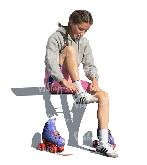 cut out woman sitting and taking off roller skating shoes