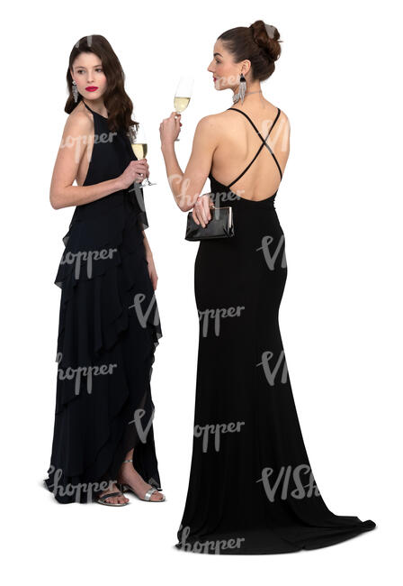 two cut out women in evening dresses standing and drinking champagne
