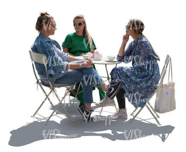 cut out group of backlit women sitting in a street cafe