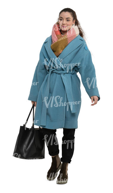 cut out woman in a blue overcoat walking