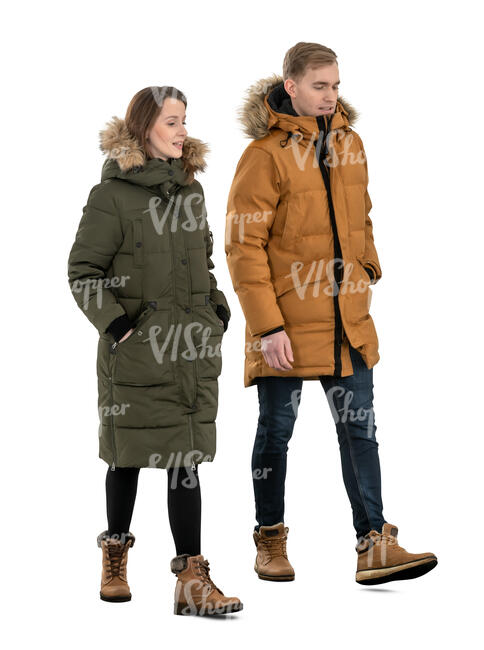 two cut out people in winter jackets walking