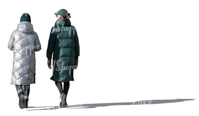 two cut out sidelit women in winter coats walking