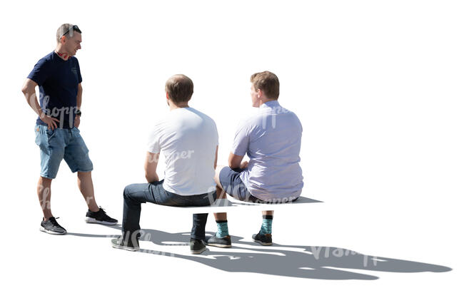 three cut out backlit men sitting and talking