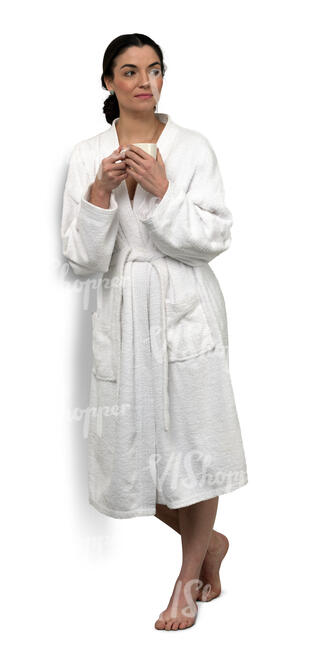 cut out woman in a bathrobe leaning against the wall and drinking coffee