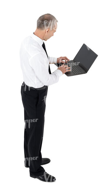 cut out businessman standing and working with laptop